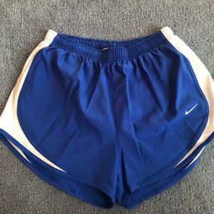 Blue Nike running shorts
